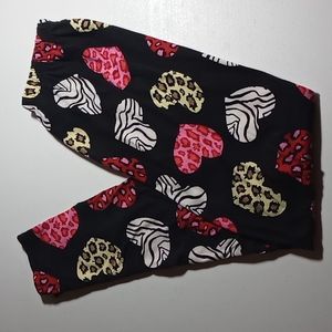 Plus size black leggings with animal print hearts. Excellent pre-owned condition